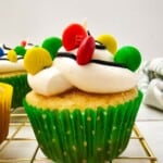A christmas light cupcake in a green wrapper.