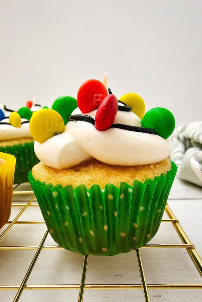 A christmas light cupcake in a green wrapper.