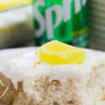 A slice of lemon sprite cake on a white plate.
