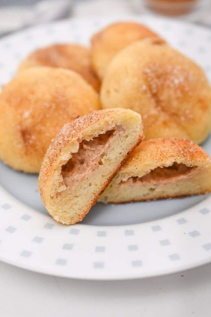A plate of the finished biscuits with one cut open.