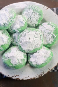 Grinch cookies covered with powdered sugar.