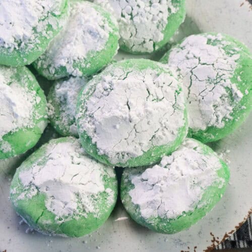 Grinch cookies covered with powdered sugar.