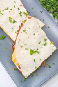 A gray tray of piadina slices on it.